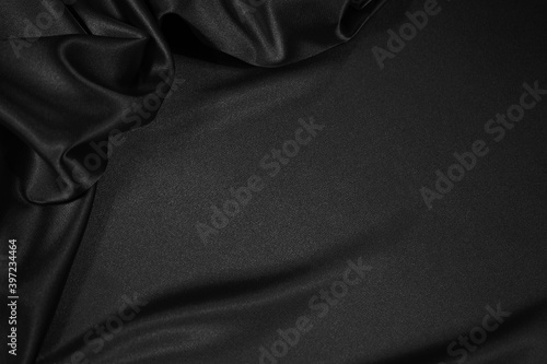  Black silk satin fabric background with copy space for your product or text. Black elegant background