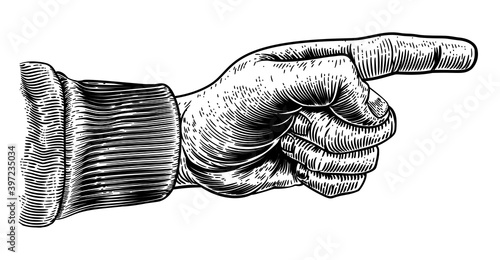 A hand pointing a finger in a direction sign. In a vintage antique engraving woodblock or woodcut style.