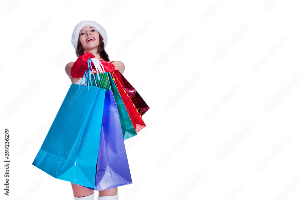 Woman in santa costume with shopping bags on white background, copy space, isolate