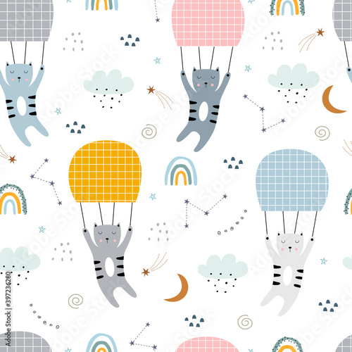 Vector pattern cute cartoon cats are airborne. Seamless background hand-drawn in the childish style used for print, wallpaper, fabric pattern, textile. Vector illustration
