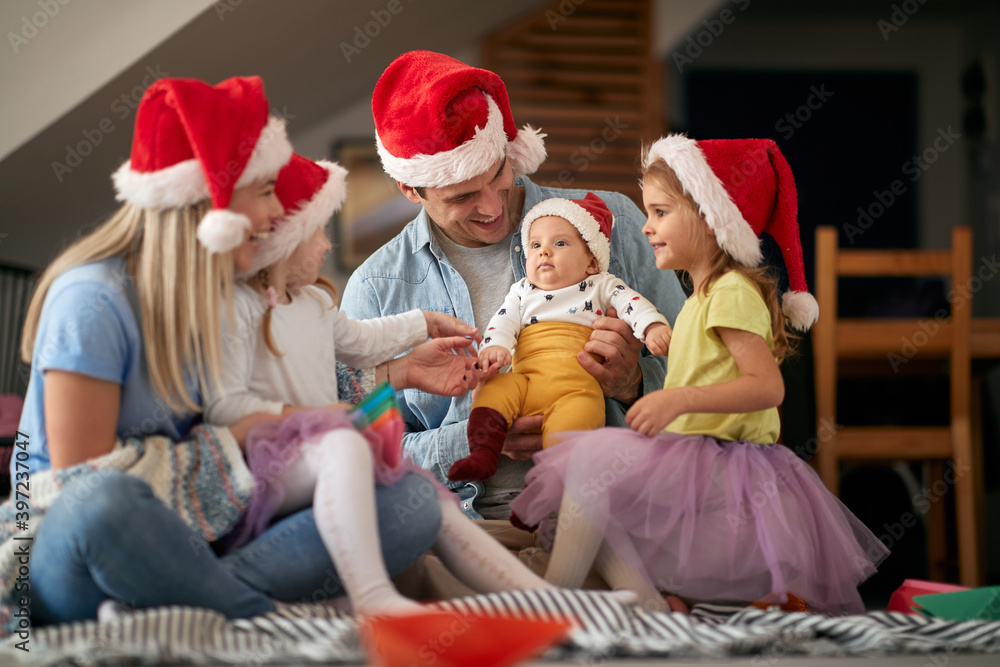 Obraz premium Happy family celebrating New Year at home. New Year, family concept, together, love