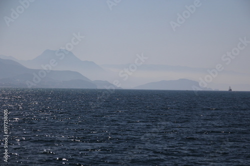 fog over the sea and a ship in the distance © Павел Карпов