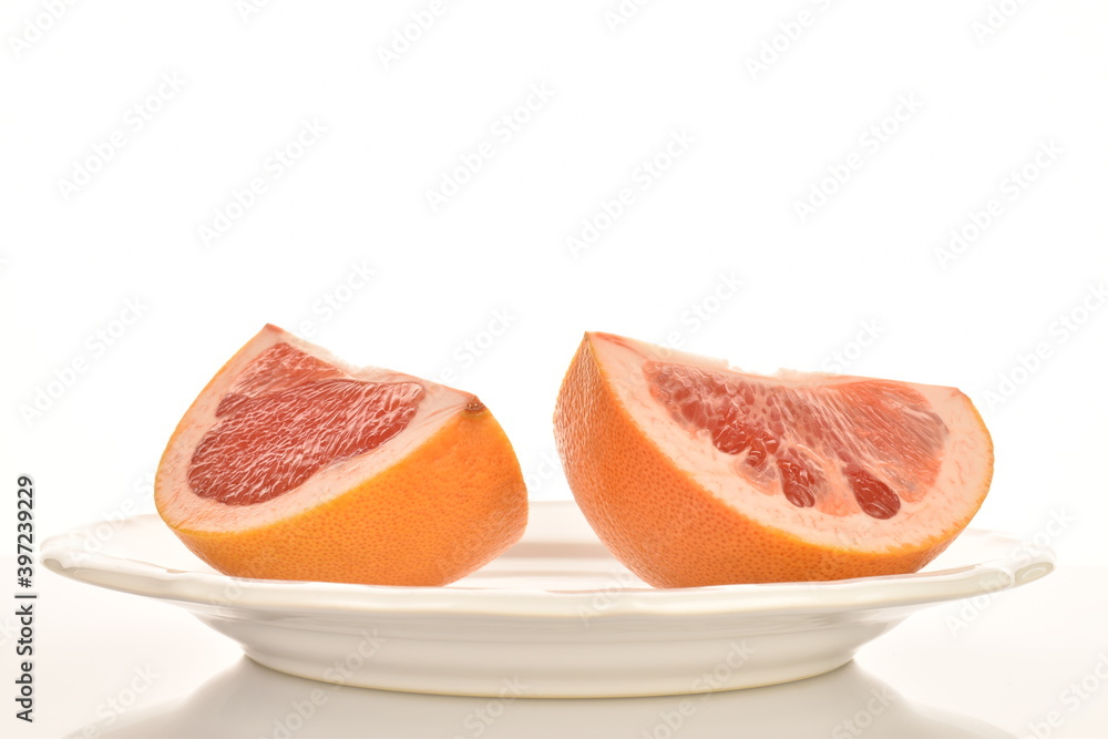 organic ripe grapefruits, close-up, isolated on white.