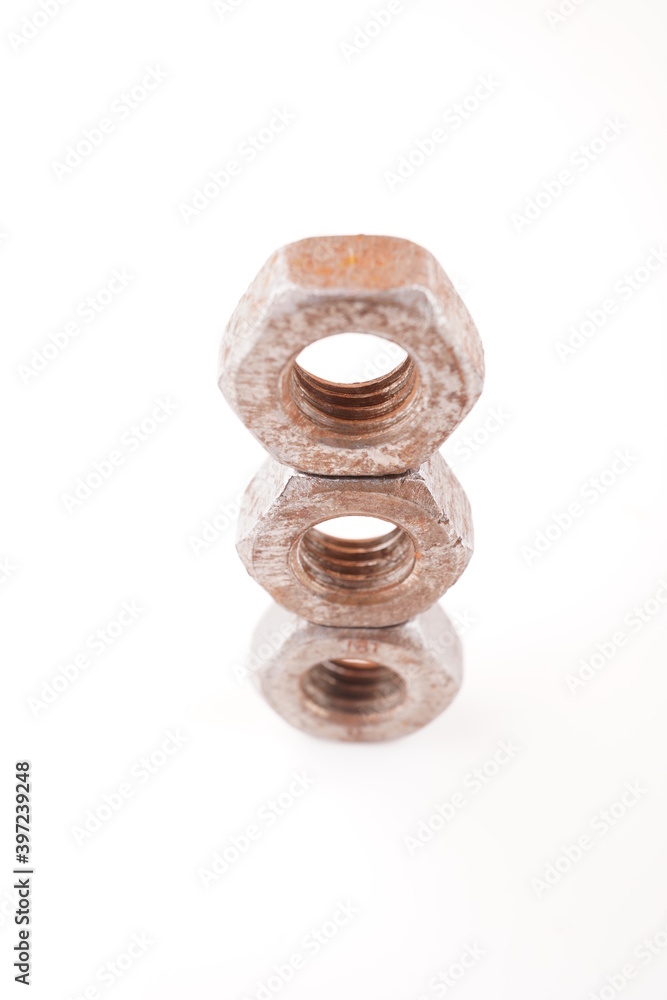 rusty nuts on white background