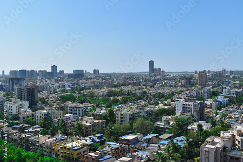 SKYLINE OF MUMBAI,GORAI AND CHARKOP WITH TOWERS AND CHALLS IN ONE POINT PERSPECTIVE.