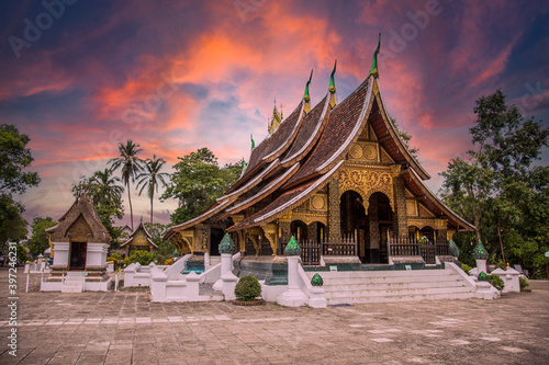 Lovely sunset at a lovely temple in Luang Prabang in summer, Laos
