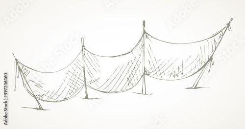 The fishing net dries on the shore. Vector drawing