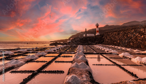 Sunset at the Fuencaliente Lighthouse next to the salt flats, on the route of the volcanoes south of the island of La Palma, Canary Islands, Spain