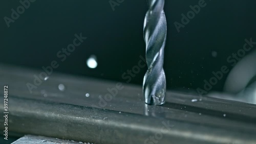 Super Slow Motion Detail Shot of Drilling Steel at 1000 fps. photo