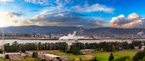 Longview, Washington, United States of America. Aerial Panoramic View of Port, Industrial Sites and Lewis and Clark Bridge over Columbia River. Sunrise Sky