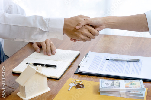 Sale representative or insurance broker handshake with customer
