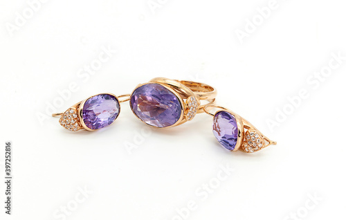 set of earrings and a ring with a blue stone
