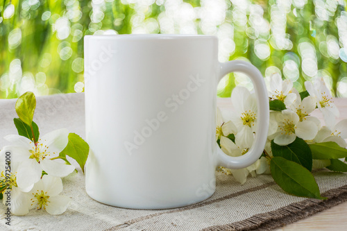 Placeit-Mug mockup with spring apple blossom photo