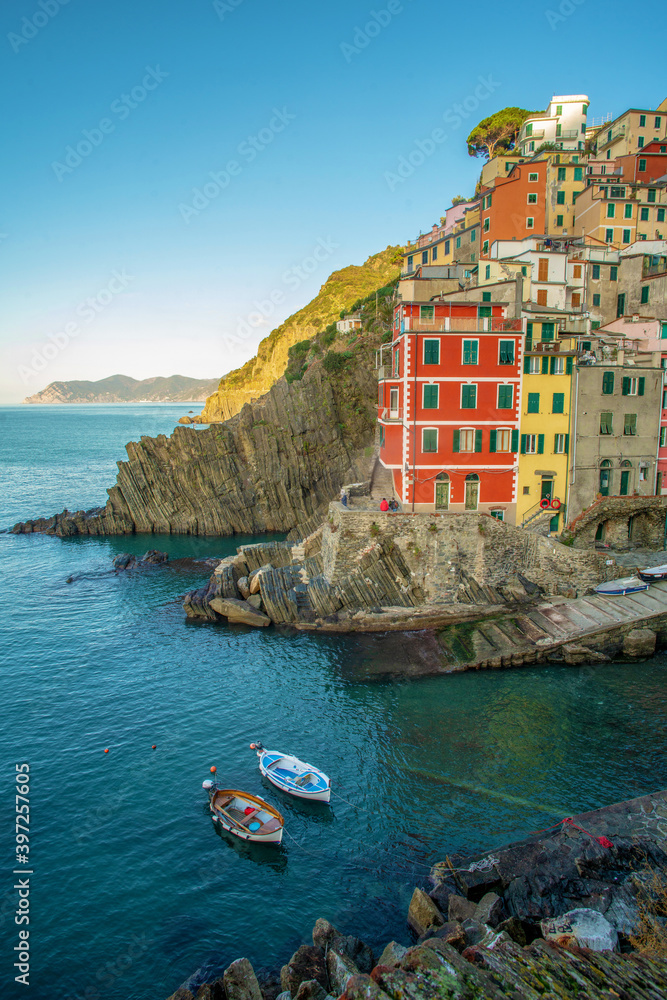 Riomaggiore town on Liguria coast in Italy -  fantastic small colorful building on rocky hill