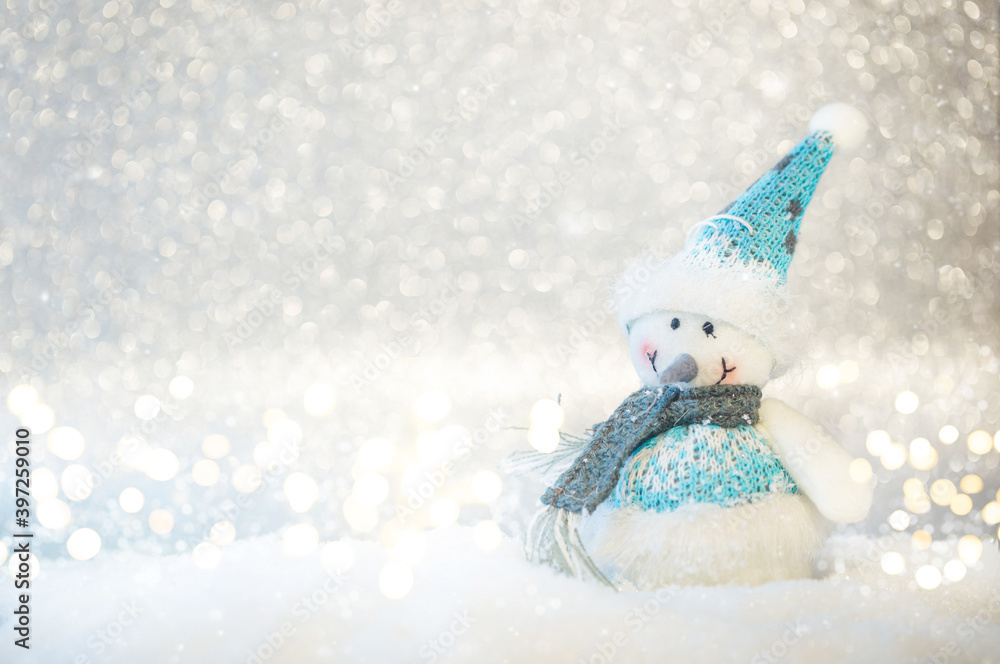Happy toy snowman standing in winter christmas background