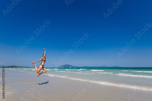 Smiling woman on wild beach Vietnam