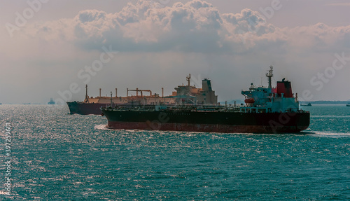 Photography Commercial tankers sailing in tandem into the sunset in the Singapore Straits in