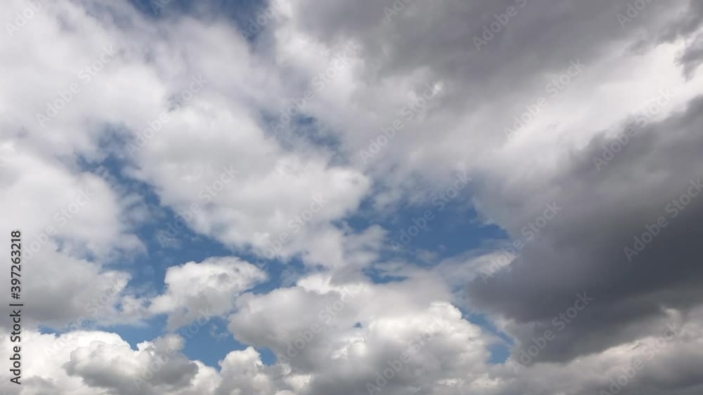 Universally Cloudscape background. Blue sky with white clouds. Puffy fluffy white clouds. Summer blue sky time lapse. Soft white clouds form. Universally Cloudscape background. Blue sky with white clouds. Puffy fluffy white clouds. Summer blue sky time lapse. Soft white clouds form.