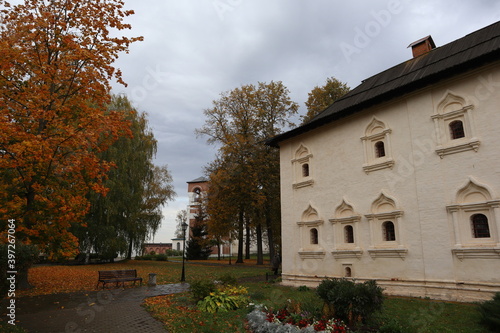 Beautiful old white building in autumn Park. Architecture, history and culture, autumn panorama of the garden. 