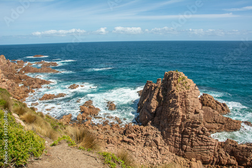 View of the spectacular rocks on Cape Woolamai Surf Beach and blue waters of the Bass Strait, Phillip Island, Victoria, Australia