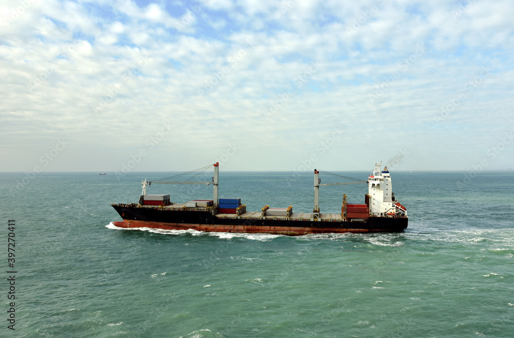Container ship departing port of Xiamen, China. 