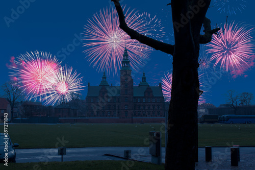 Celebratory fireworks for new year over Rosenborg Castle in Copenhagen, Denmark during last night of year. Christmas atmosphere.