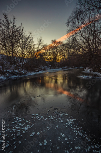 winter landscape on a frozen river in severe frost