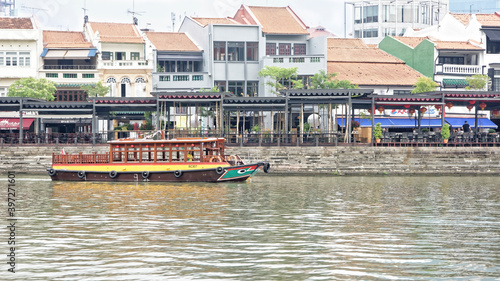  View of the Boat Quay on the River Singapore.On the river floats boat
