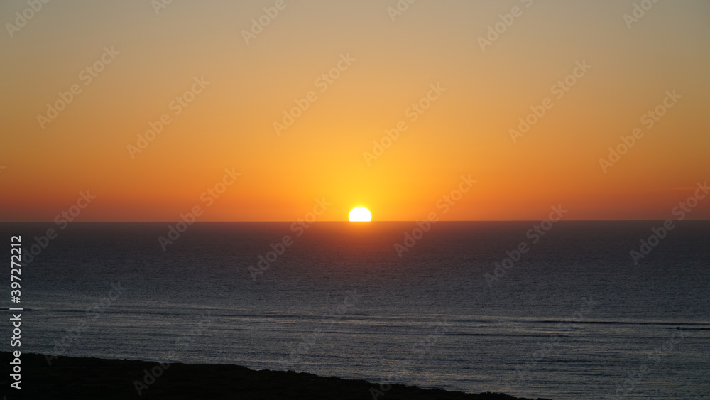 Sunset over the ocean seen from the Thomas Carter Lookout near Exmouth, Western Australia.