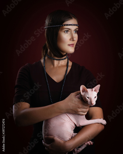 Portrait of a girl with a bald cat based on the painting by Leonardo da Vinci 