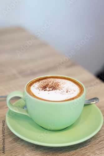 Green Cup Of Coffee Latte On Wooden Background, Close Up Of Art Coffee In Morning.