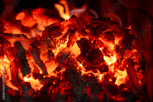Burning coals in the stove close up