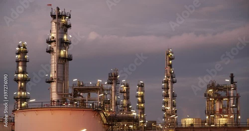 Timelapse manufacturing oil refinery,petrochemical Day to Night. terminal is industrial facility for storage of oil petrochemical. Business Industrial and energy.