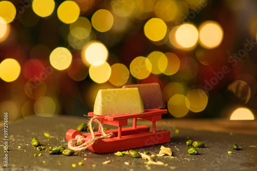 Pistachio candies on the background of the Christmas tree