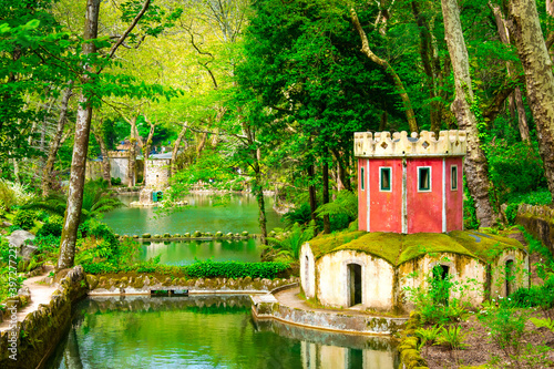 Beautiful garden near the Pena Palace. The green park in Sintra, Portugal with architecture. 