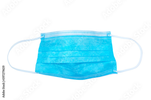 Blue medical surgical face mask isolated on white.