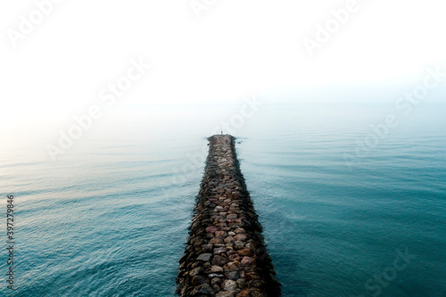 Break water on the sea with fog.