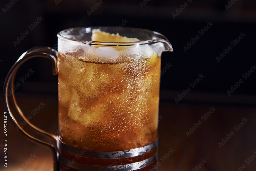 Ice cubes inside. Close up view of fresh summer cocktail on the wooden table Ice cubes inside. Close up view of fresh summer cocktail on the wooden table