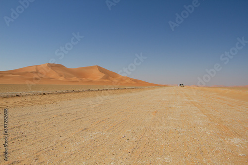 Dirt road in the desert of the Empty Quarter in Oman.
