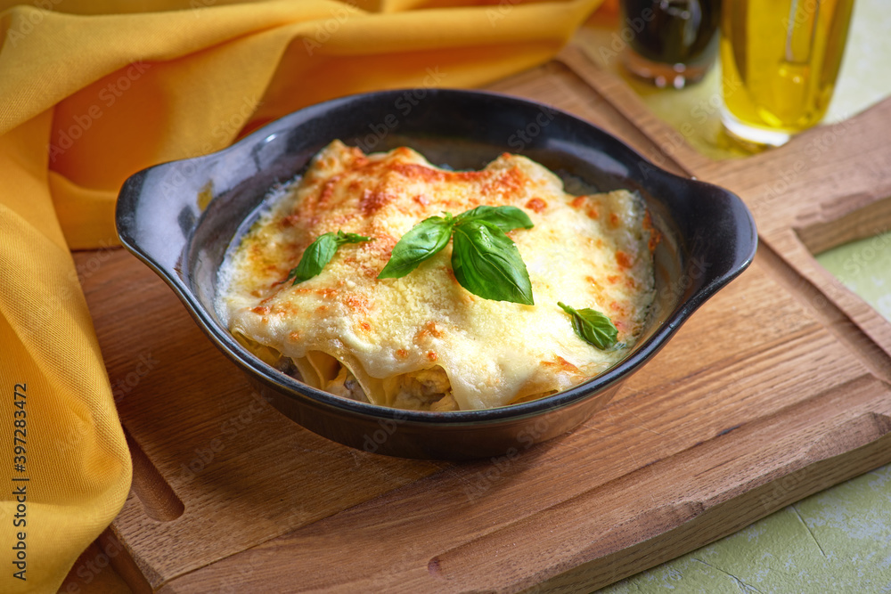 Kannelloni with chicken and mushrooms baked in sauce bechamel Kannelloni with chicken and mushrooms baked in sauce bechamel
