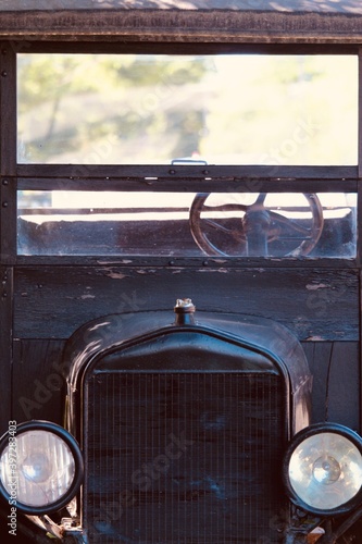 full frame of old car in the street