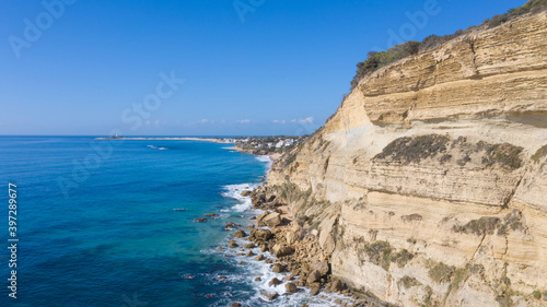 Aerial perspectives of a south Spanish beach in Andalusia with turquoise blue water. Andalusian Atlantic beach background. Ocean in Caños de Meca, Cádiz, Andalusia, Spain.