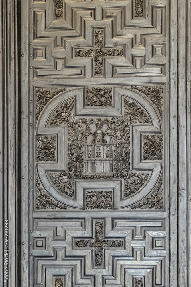 A fragment of a relief door to the Mosque-Cathedral of Cordoba (Mezquita-Catedral de Cordoba), also known as Great Mosque (from 785), monuments of Moorish architecture. Andalusia, Cordoba, Spain. A fragment of a relief door to the Mosque-Cathedral of Cordoba (Mezquita-Catedral de Cordoba), also known as Great Mosque (from 785), monuments of Moorish architecture. Andalusia, Cordoba, Spain.