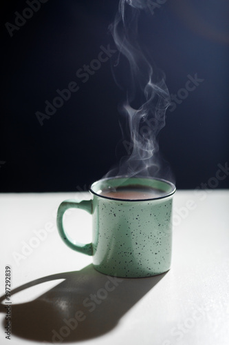 a cup of hot coffee on the table