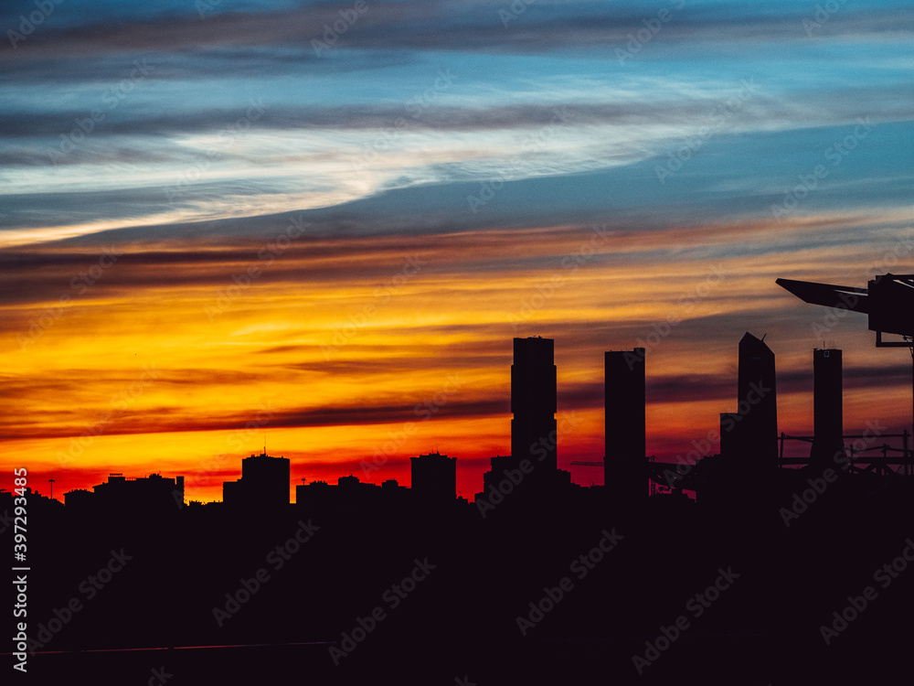 Natural colors at sunset in front of the four towers of madrid in the financial district Natural colors at sunset in front of the four towers of madrid in the financial district