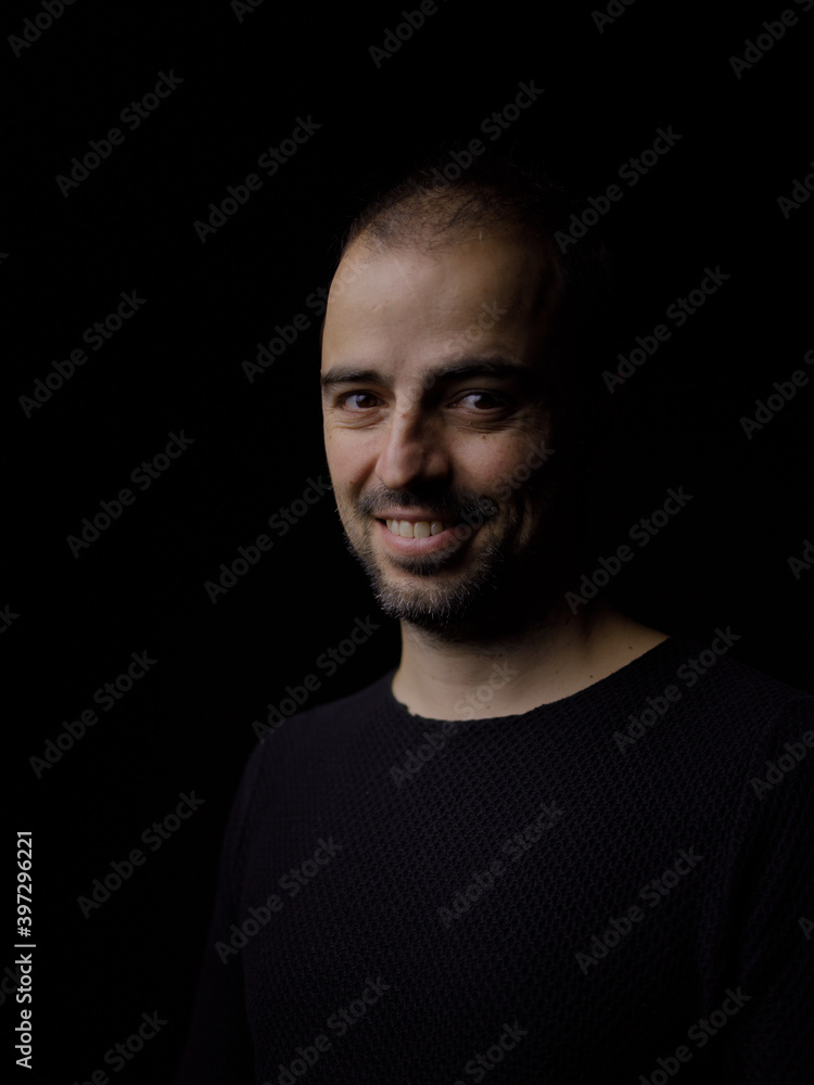 Fototapeta premium Portrait of a man in a dark environment