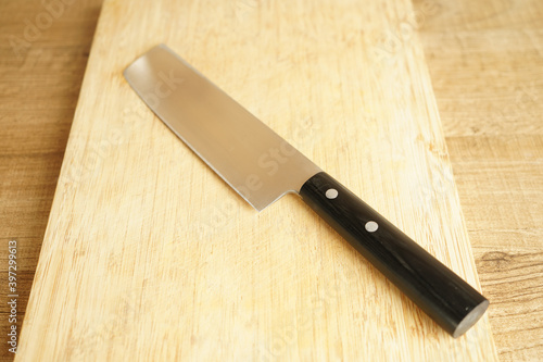 chef's knife on a wooden cutting Board