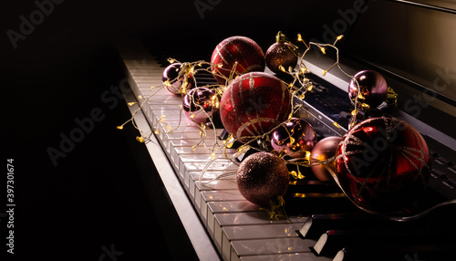 Photography Festive decor on piano keys indoors, closeup. Christmas music