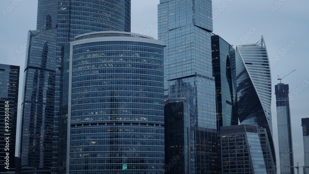 Fototapeta premium Moscow city glass skyscrapers. Famous Moscow International Business Center during an evening time, with glares from the sun