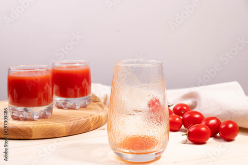 Wallpaper Mural tomato juice in a glass and tomatoes Torontodigital.ca